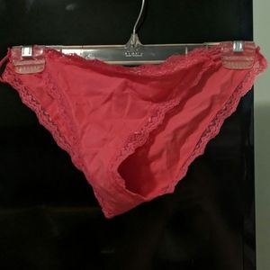 Pink lacy panties with strappy sides.